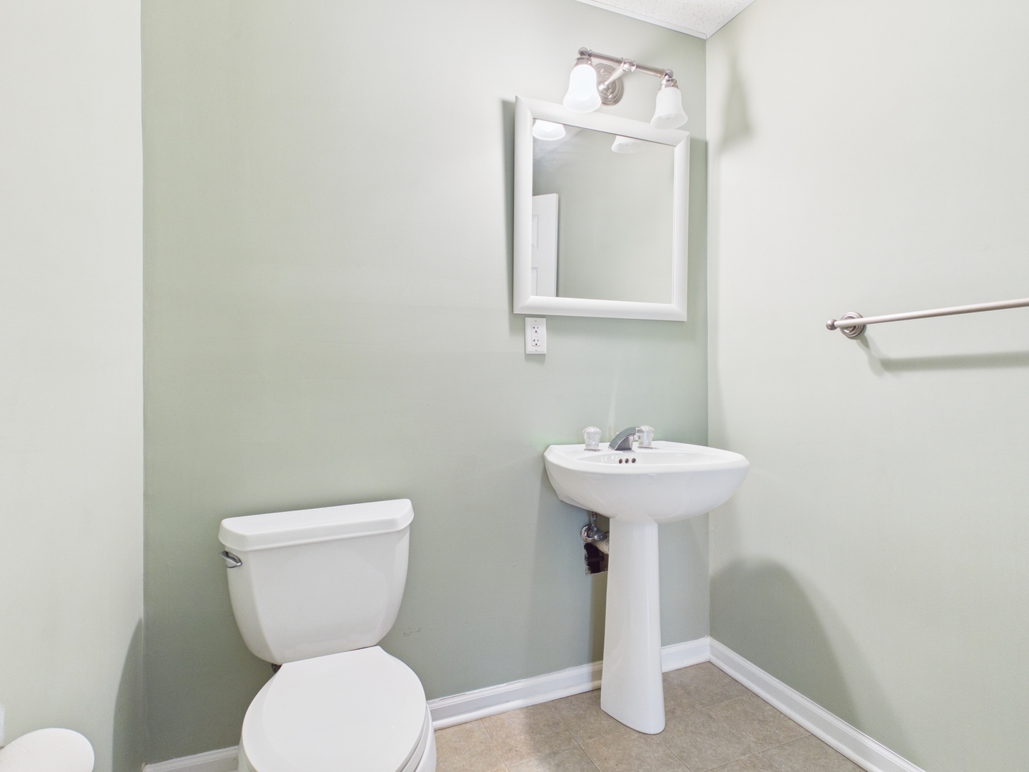 7486 Abbey Road Gurnee, IL 60031 - Photo 30 of 35 a bathroom with a toilet sink and mirror