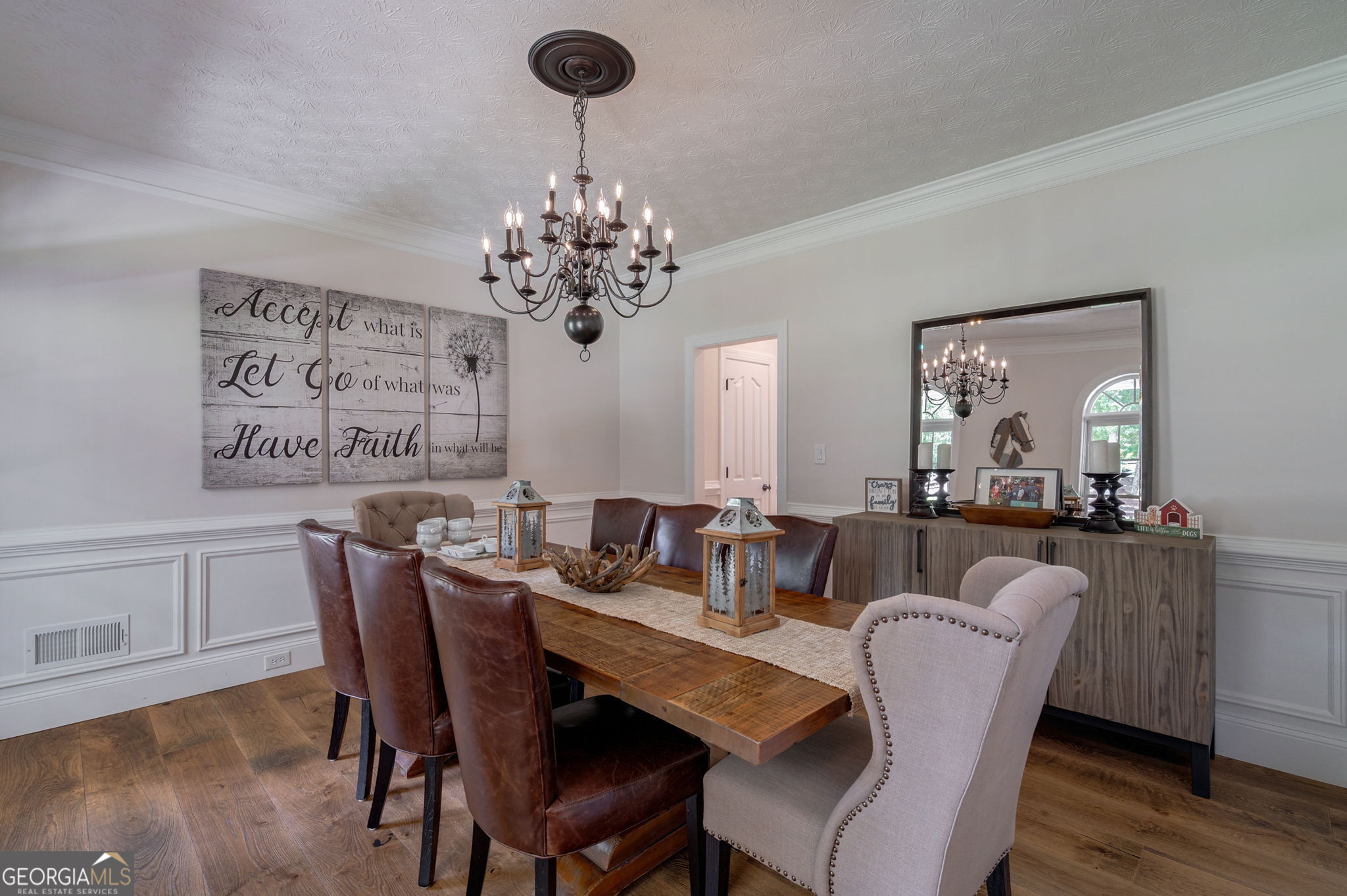 2391 Rabbit Farm Circle Loganville, GA 30052 - Photo 15 of 97 a view of a dining room with furniture wooden floor and chandelier