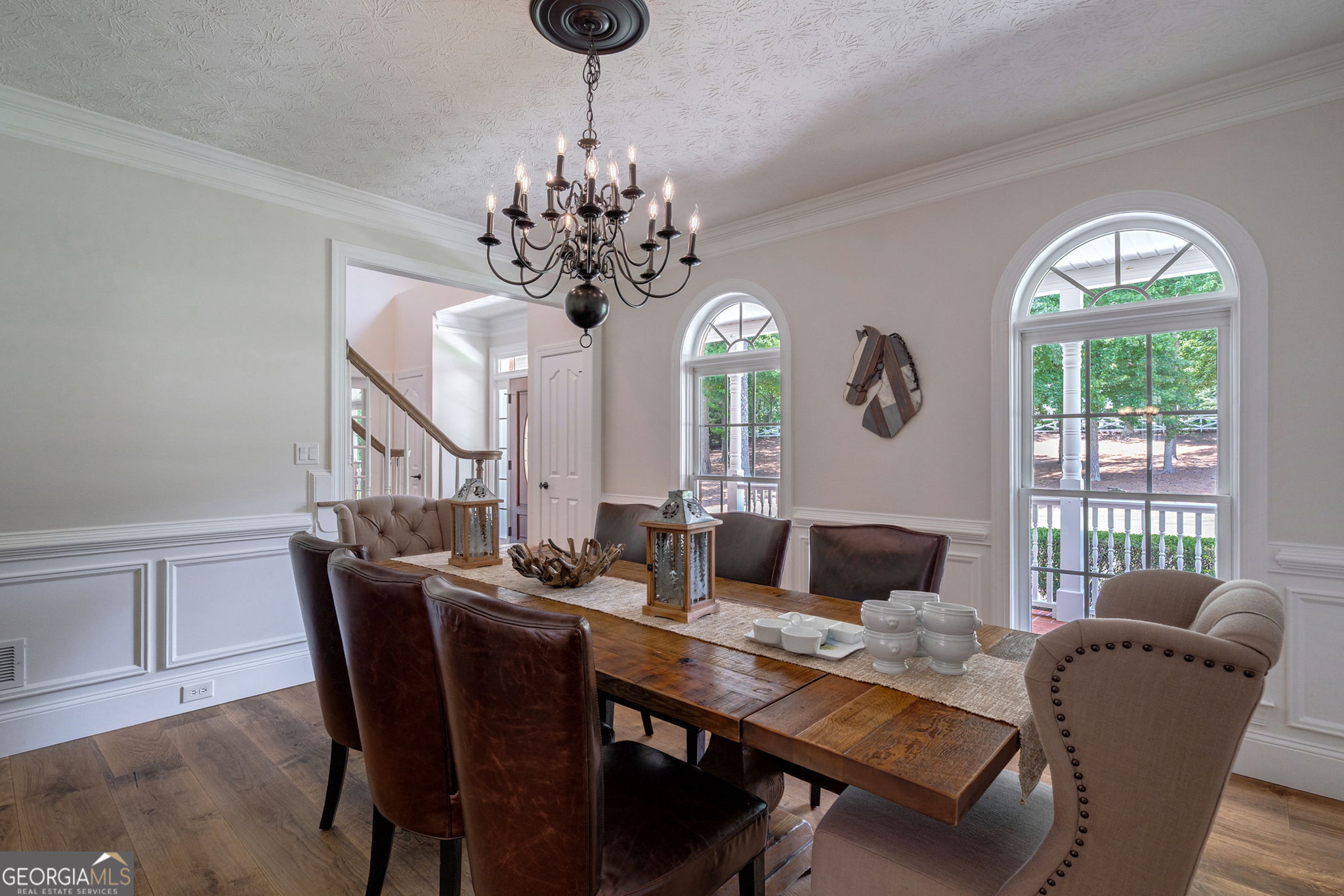 2391 Rabbit Farm Circle Loganville, GA 30052 - Photo 16 of 97 a living room with furniture dining table and a chandelier