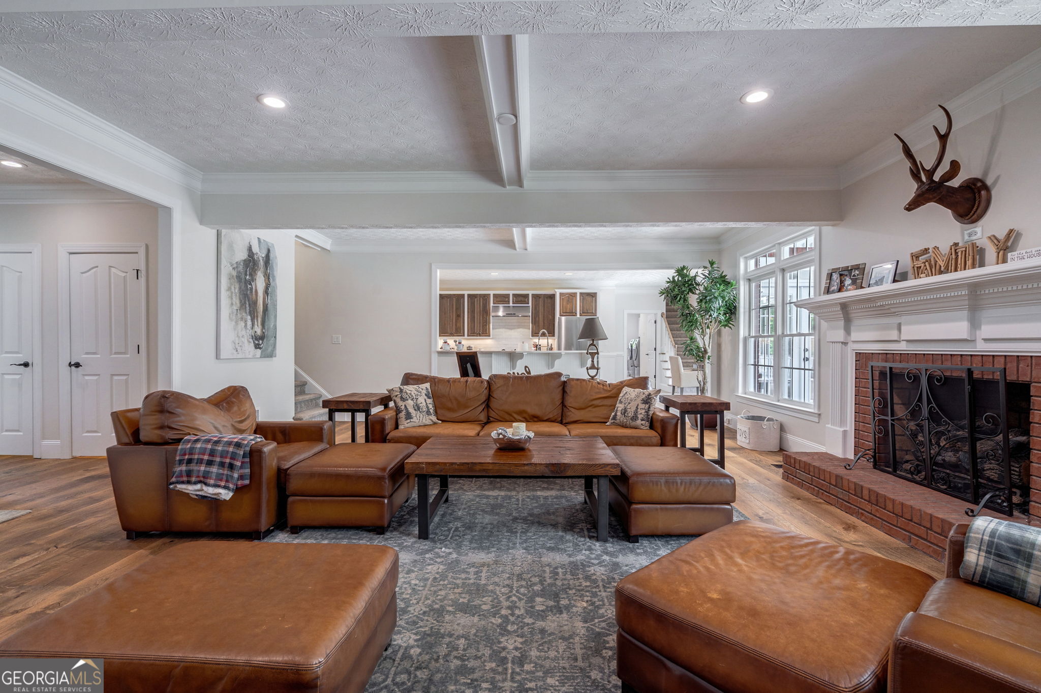 2391 Rabbit Farm Circle Loganville, GA 30052 - Photo 19 of 97 a living room with furniture a fireplace and a chandelier