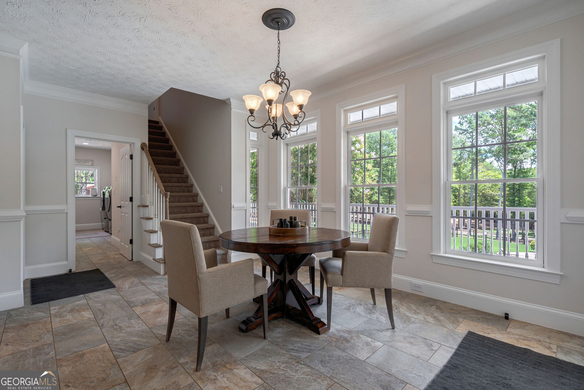 2391 Rabbit Farm Circle Loganville, GA 30052 - Photo 28 of 97 a view of a dining room with furniture window and wooden floor