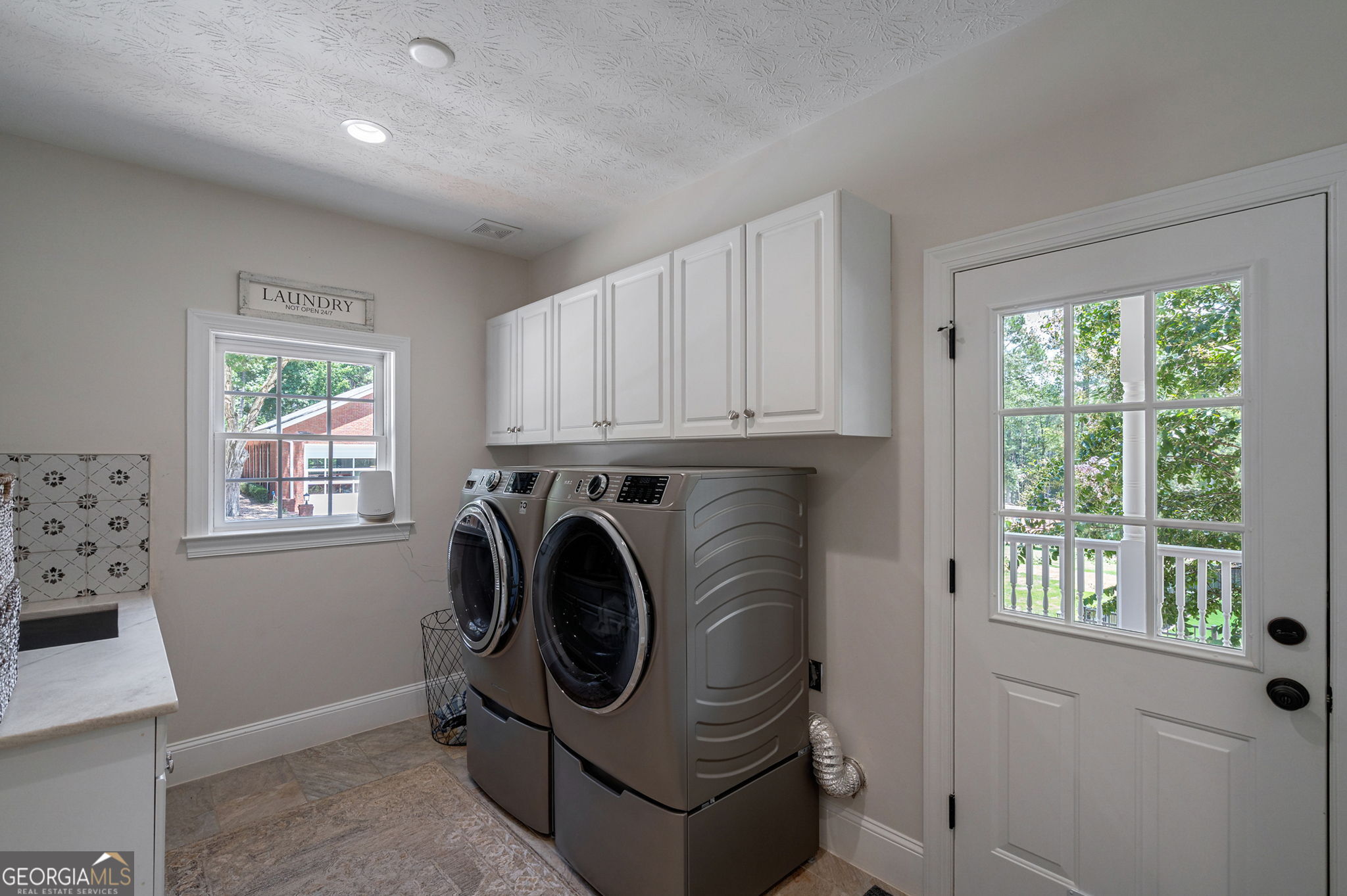 2391 Rabbit Farm Circle Loganville, GA 30052 - Photo 37 of 97 a utility room with dryer and washer