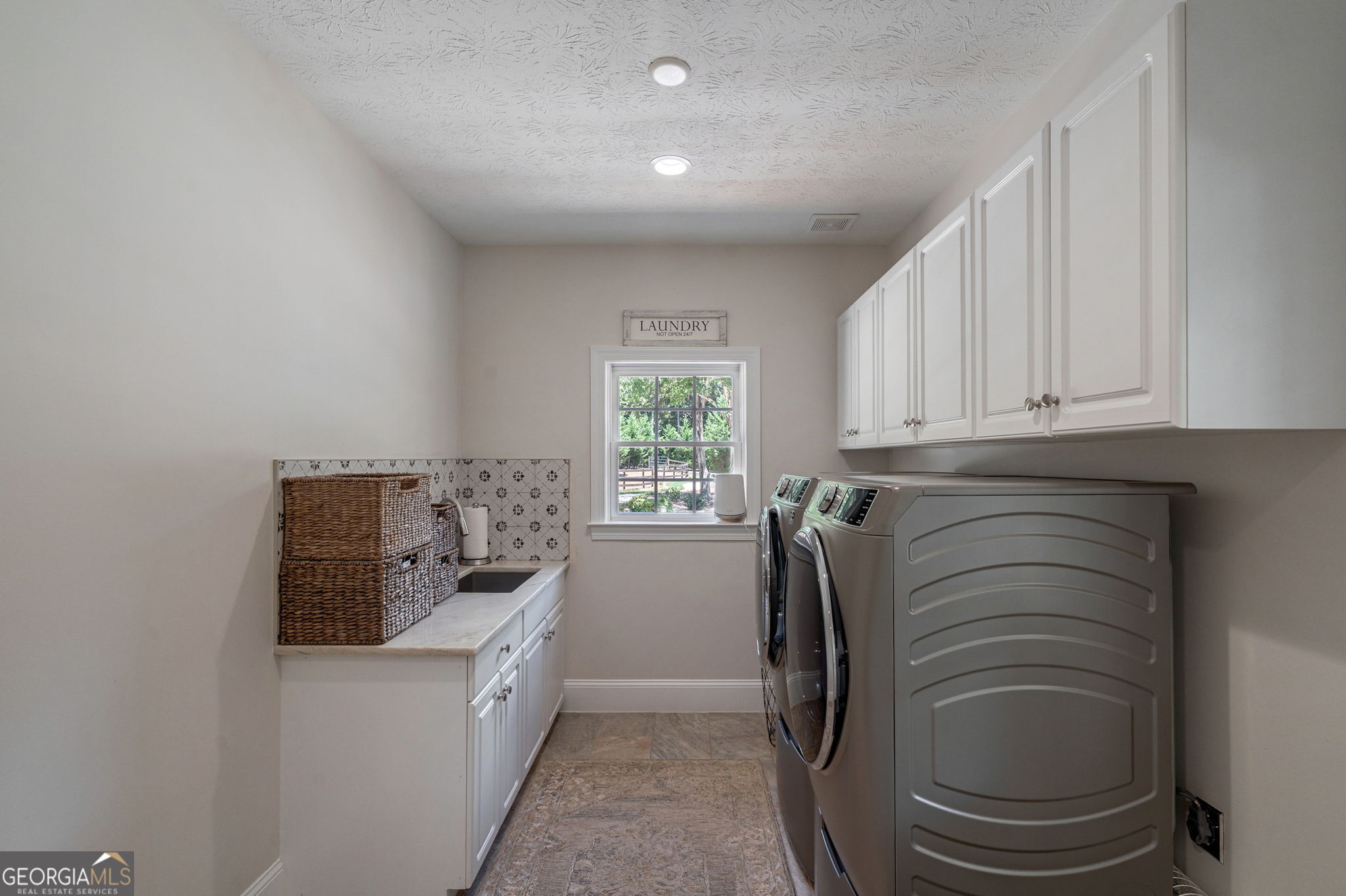 2391 Rabbit Farm Circle Loganville, GA 30052 - Photo 38 of 97 a bathroom with a granite countertop toilet and a sink