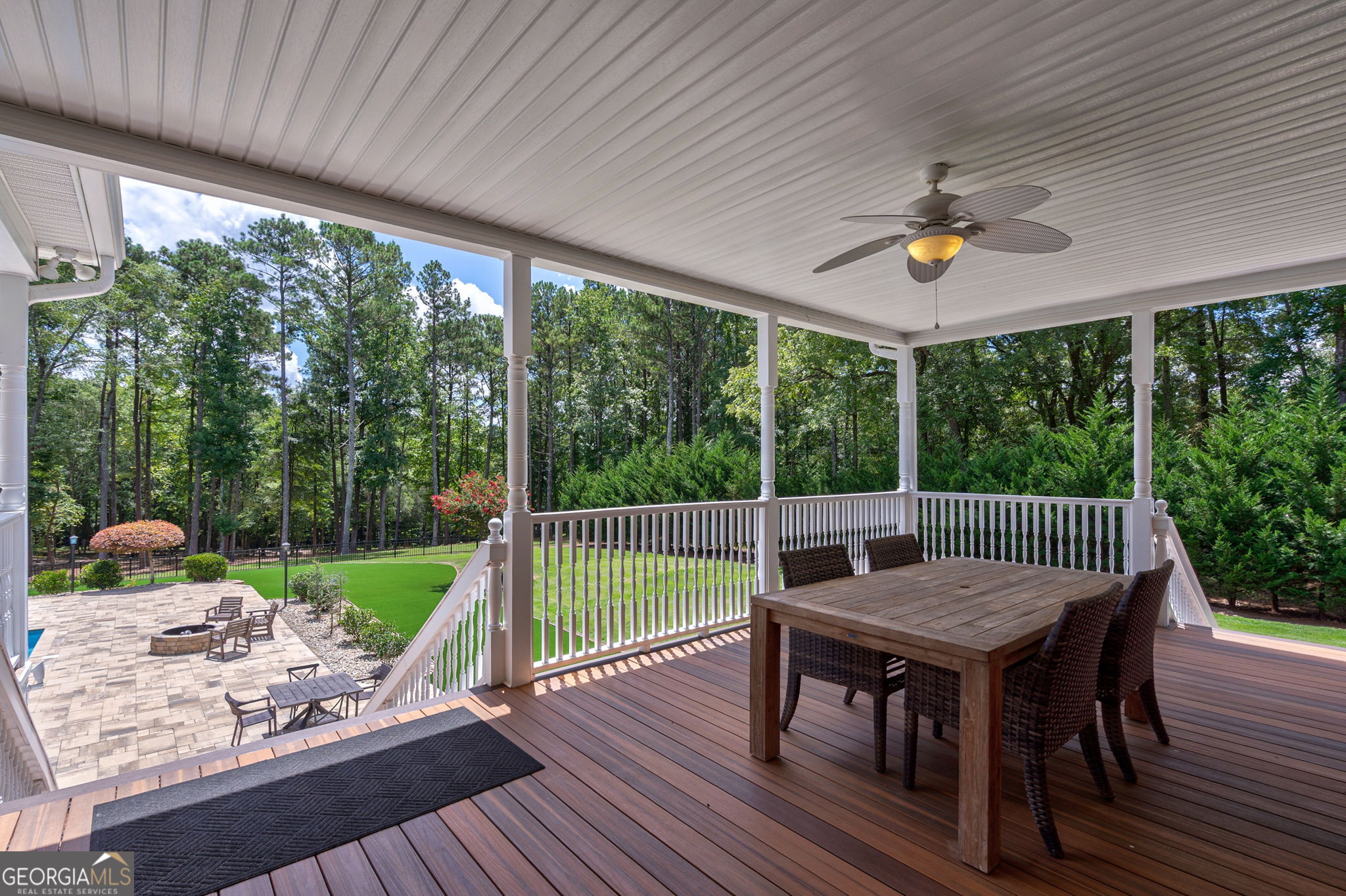 2391 Rabbit Farm Circle Loganville, GA 30052 - Photo 39 of 97 a view of a deck with a table chairs and a yard