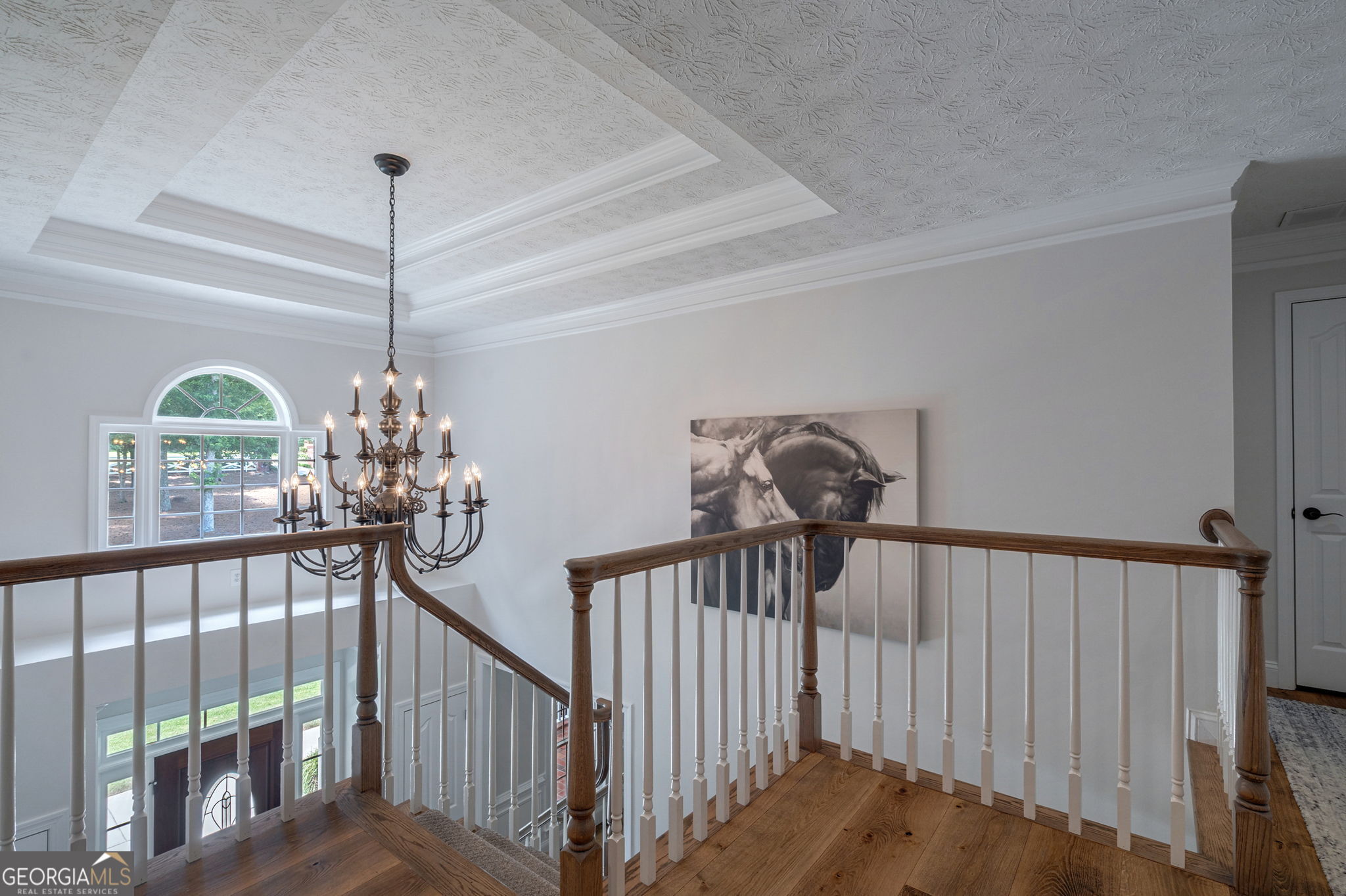 2391 Rabbit Farm Circle Loganville, GA 30052 - Photo 44 of 97 a view of a hallway view with a chandelier