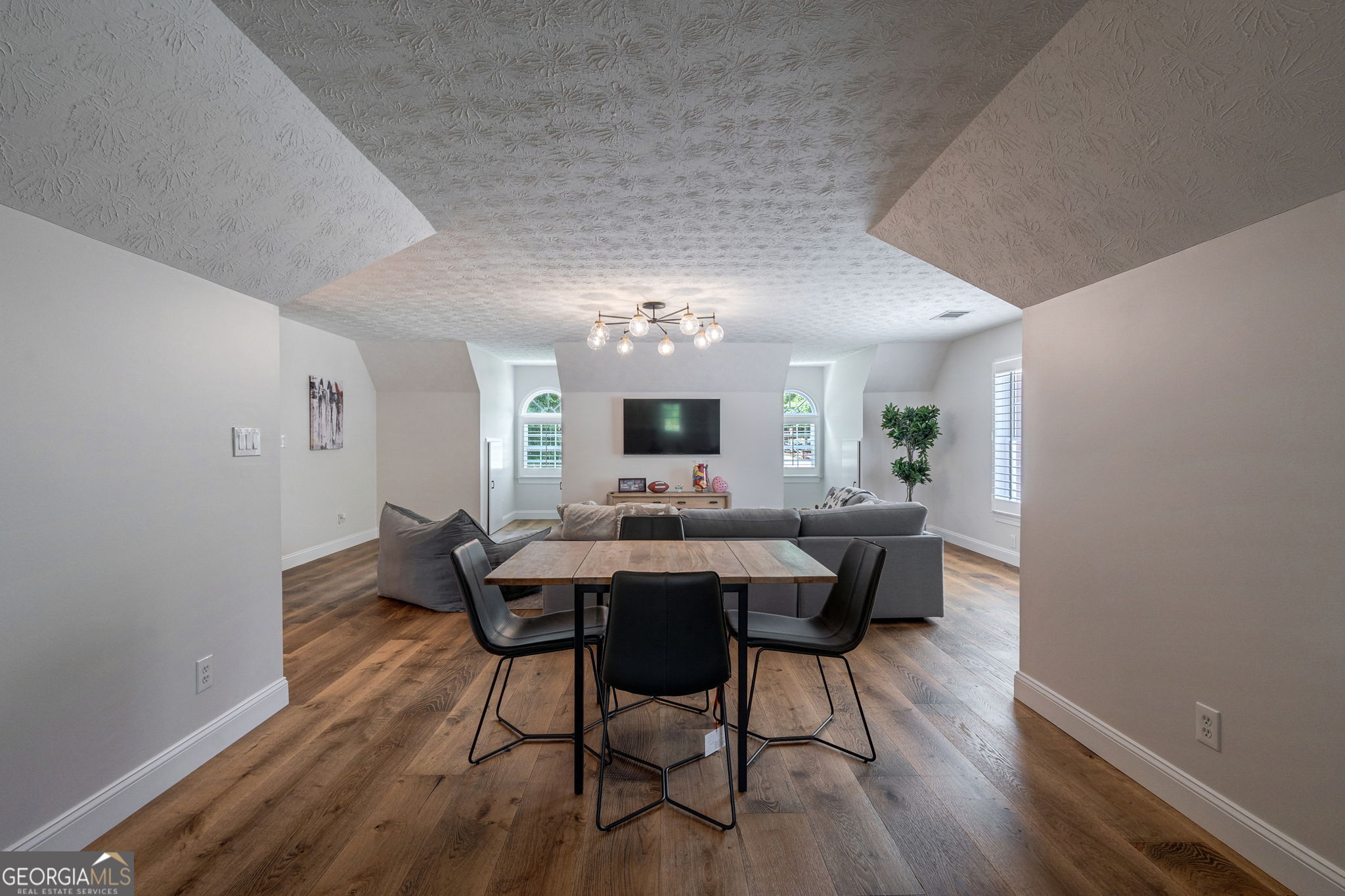 2391 Rabbit Farm Circle Loganville, GA 30052 - Photo 47 of 97 a view of a dining room with furniture and wooden floor