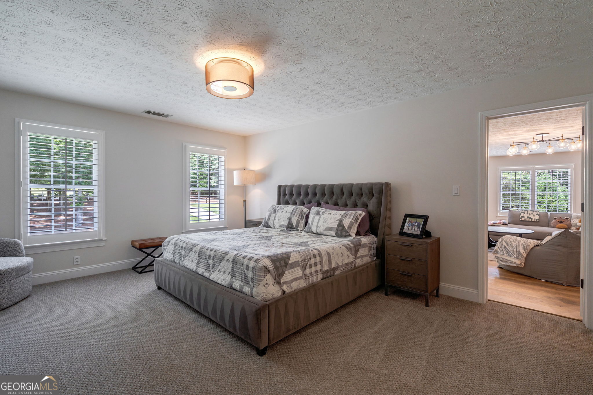 2391 Rabbit Farm Circle Loganville, GA 30052 - Photo 49 of 97 a spacious bedroom with a bed and a window