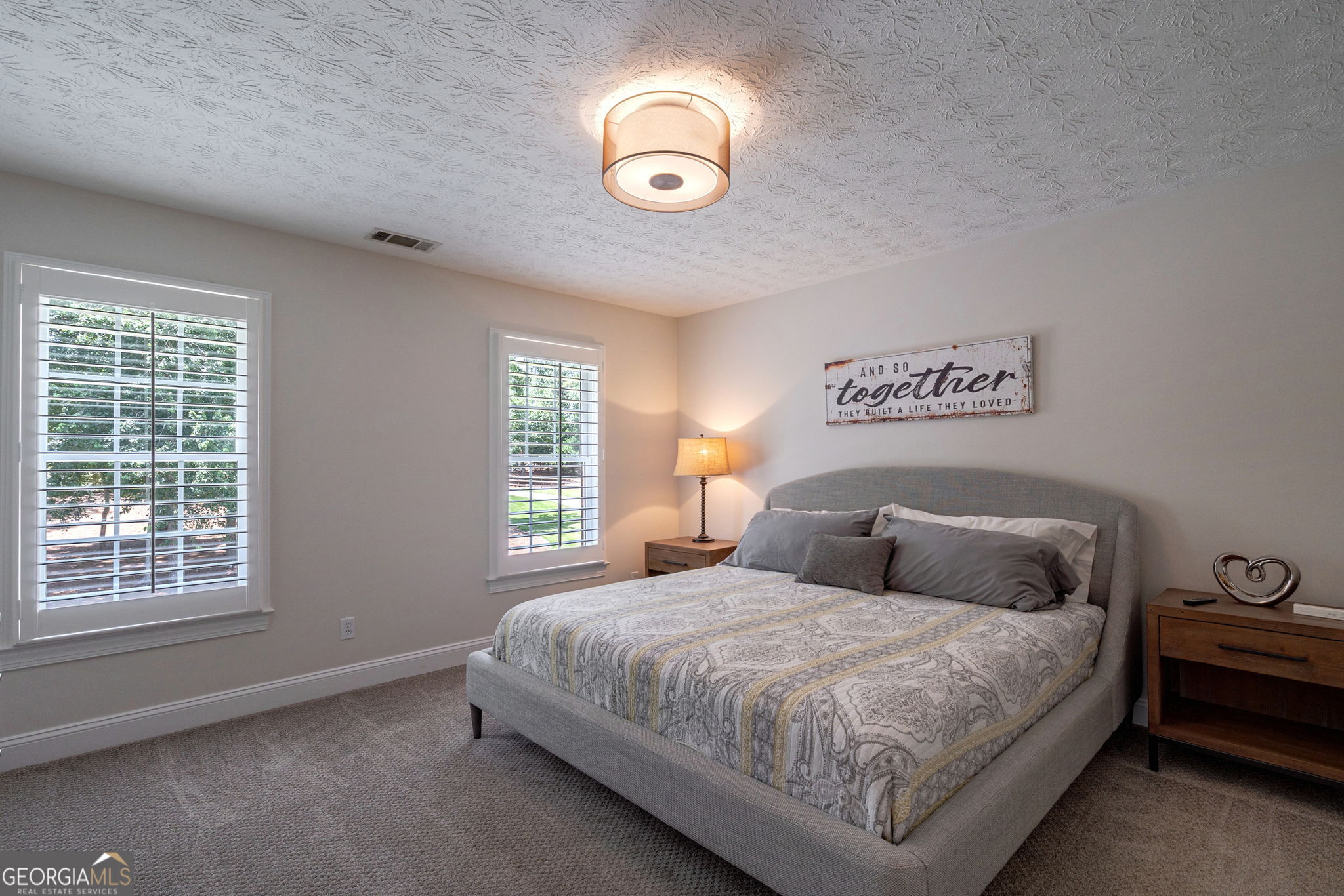 2391 Rabbit Farm Circle Loganville, GA 30052 - Photo 55 of 97 a bedroom with a bed and a window