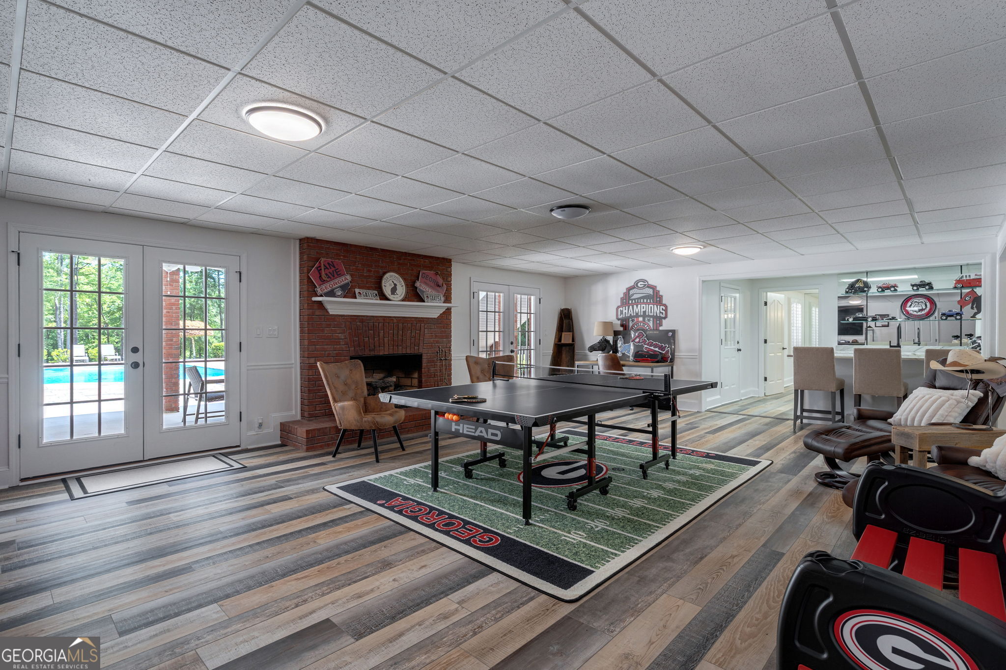 2391 Rabbit Farm Circle Loganville, GA 30052 - Photo 59 of 97 a living room with furniture a piano and a floor to ceiling window