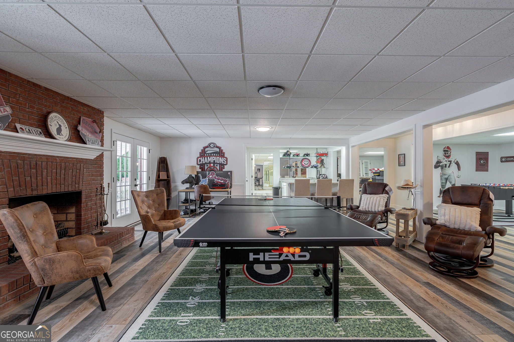 2391 Rabbit Farm Circle Loganville, GA 30052 - Photo 60 of 97 a living room with furniture a table and a fireplace