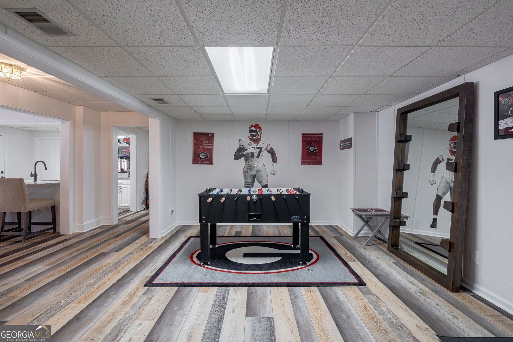 2391 Rabbit Farm Circle Loganville, GA 30052 - Photo 62 of 97 a living room with furniture a rug and wall painting