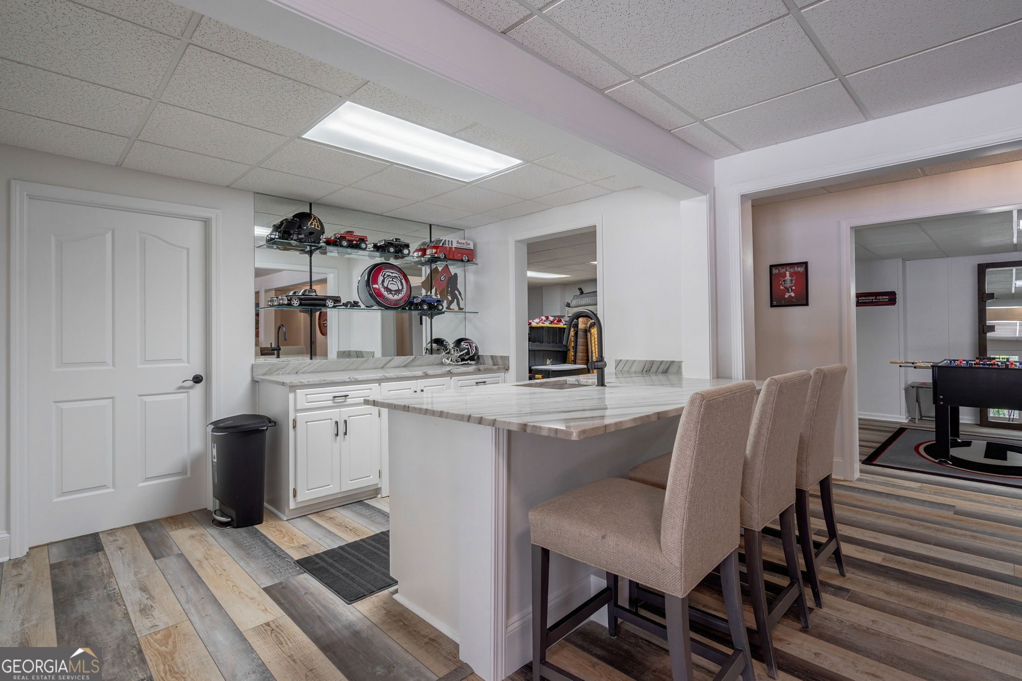 2391 Rabbit Farm Circle Loganville, GA 30052 - Photo 64 of 97 a view of a dining room with furniture and wooden floor