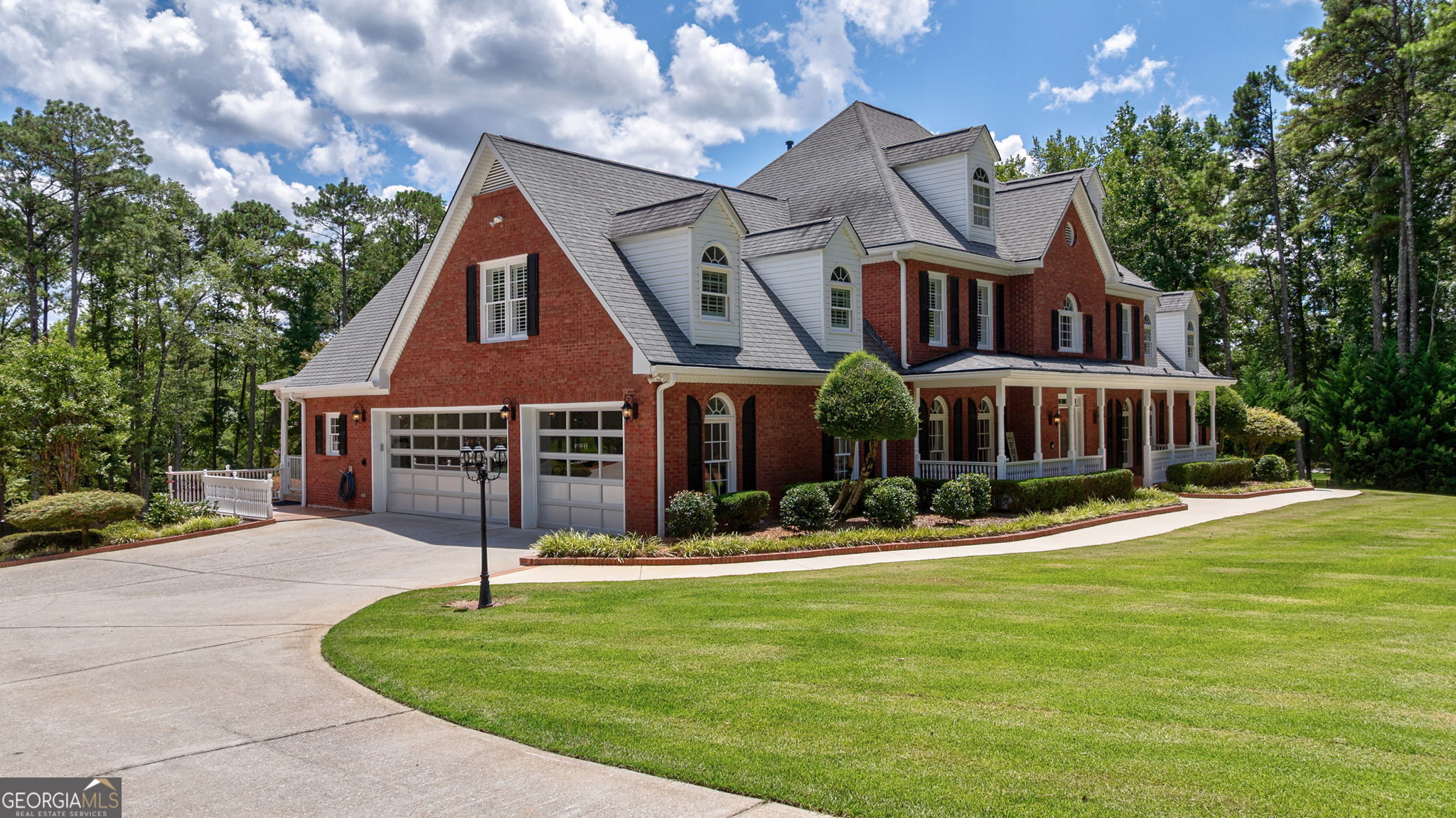 2391 Rabbit Farm Circle Loganville, GA 30052 - Photo 7 of 97 a front view of a house with garden