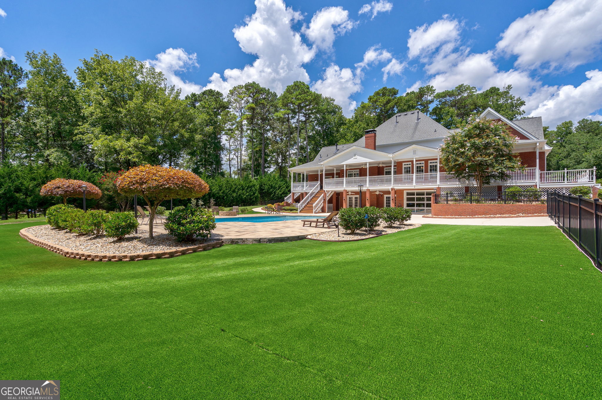 2391 Rabbit Farm Circle Loganville, GA 30052 - Photo 71 of 97 a view of a house with a backyard porch and sitting area