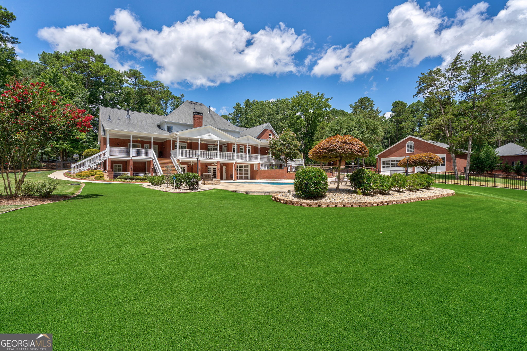2391 Rabbit Farm Circle Loganville, GA 30052 - Photo 72 of 97 a front view of a house with garden and trees