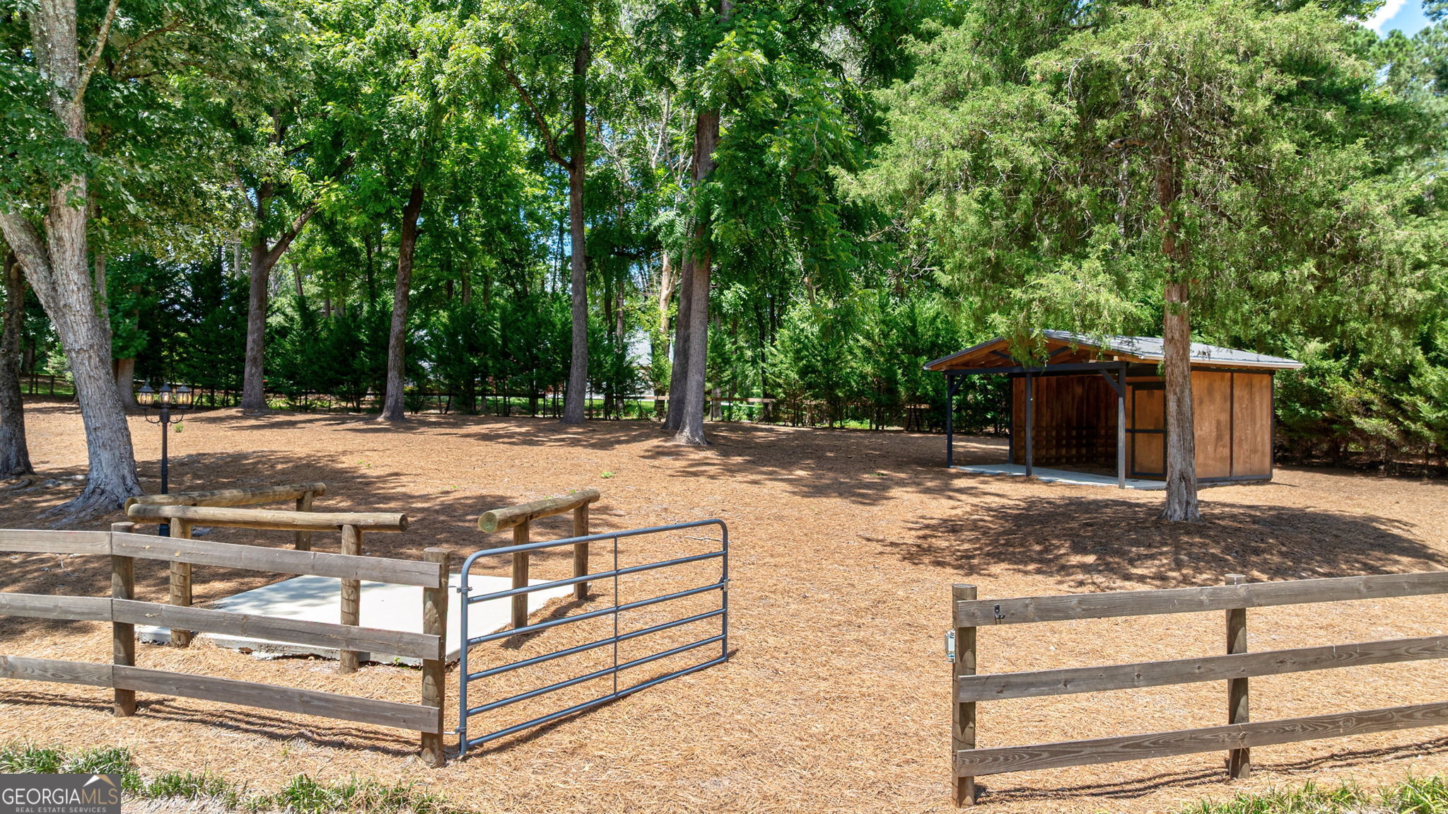 2391 Rabbit Farm Circle Loganville, GA 30052 - Photo 73 of 97 a view of a yard with wooden fence