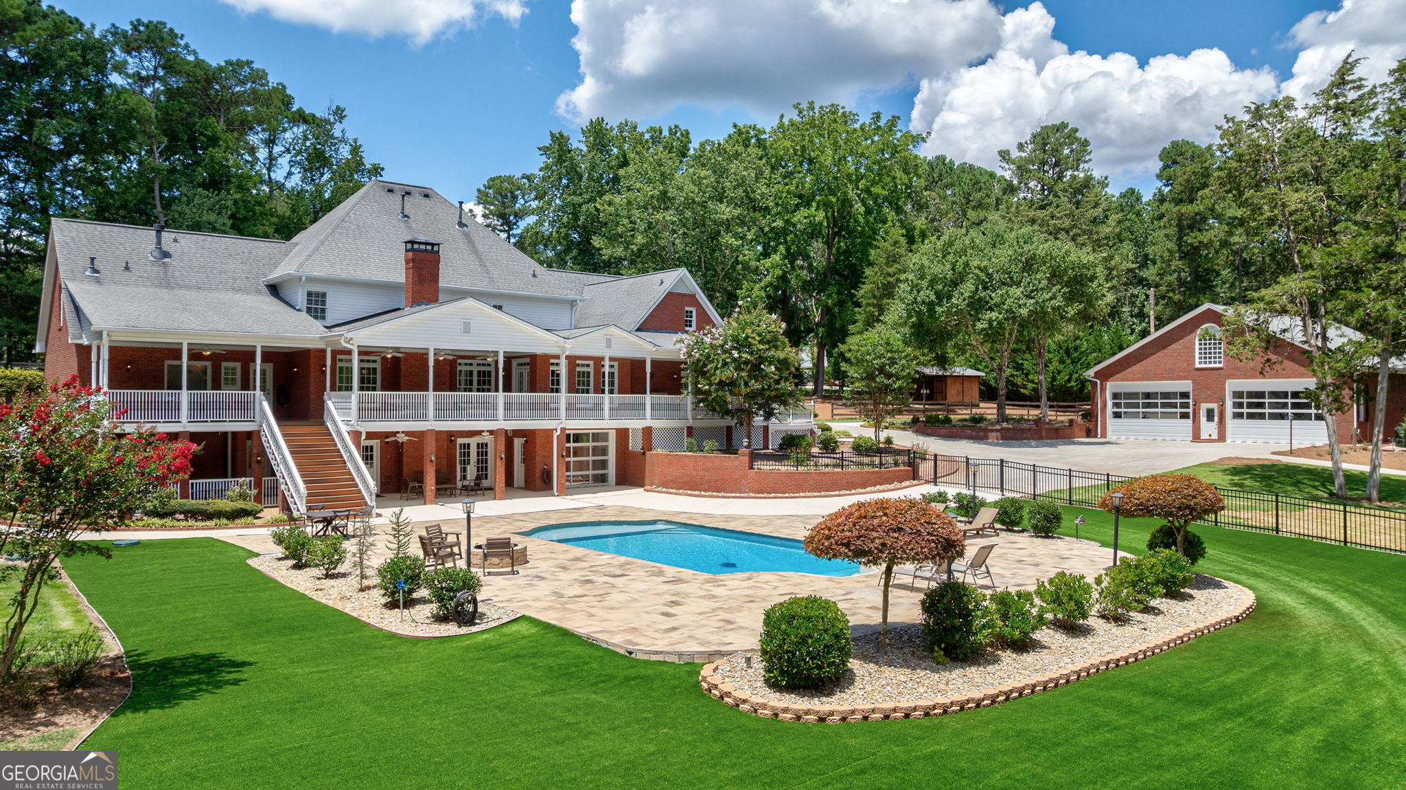 2391 Rabbit Farm Circle Loganville, GA 30052 - Photo 85 of 97 a front view of a house with garden and sitting area