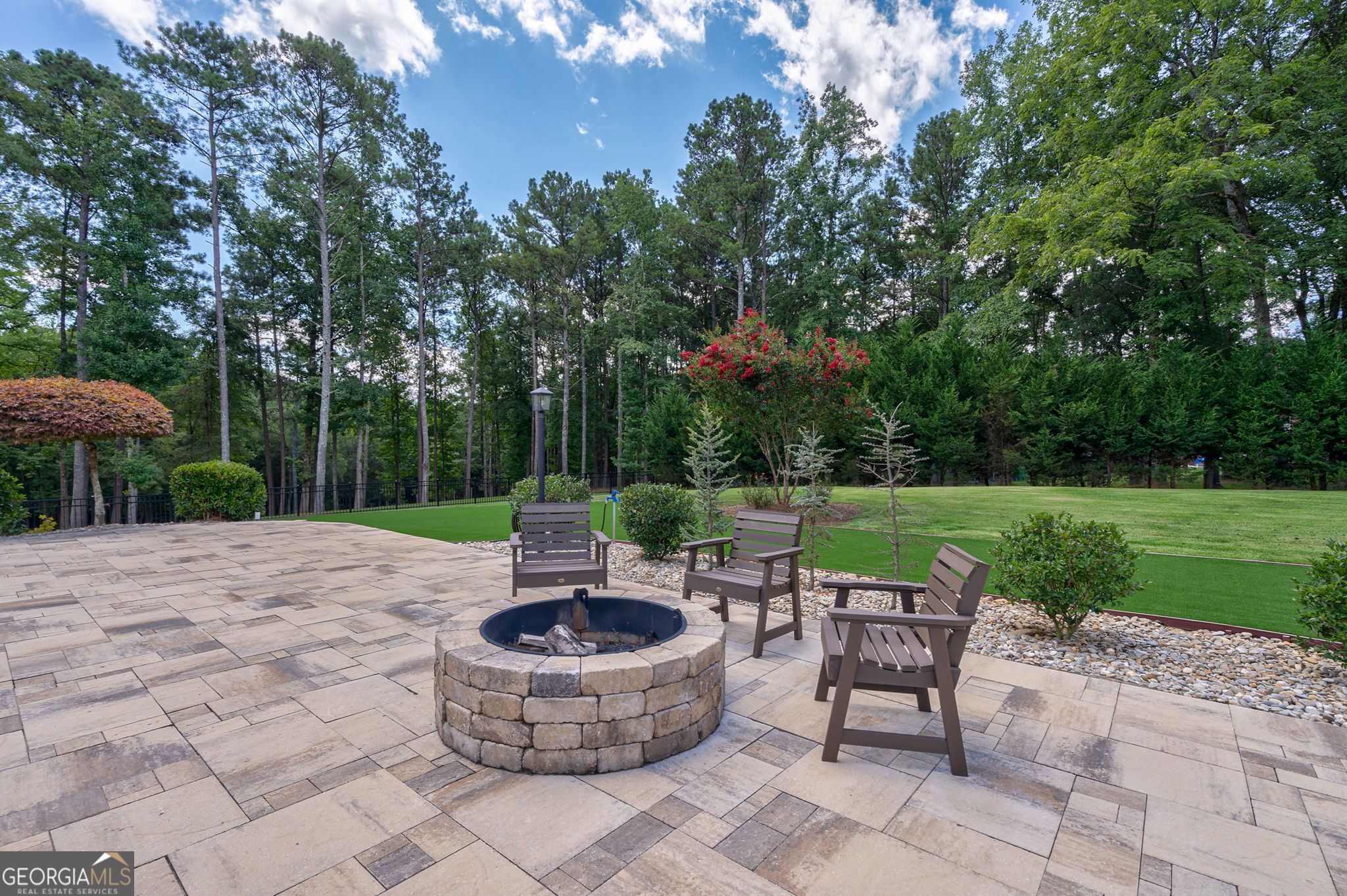 2391 Rabbit Farm Circle Loganville, GA 30052 - Photo 89 of 97 a view of a backyard with sitting area and garden