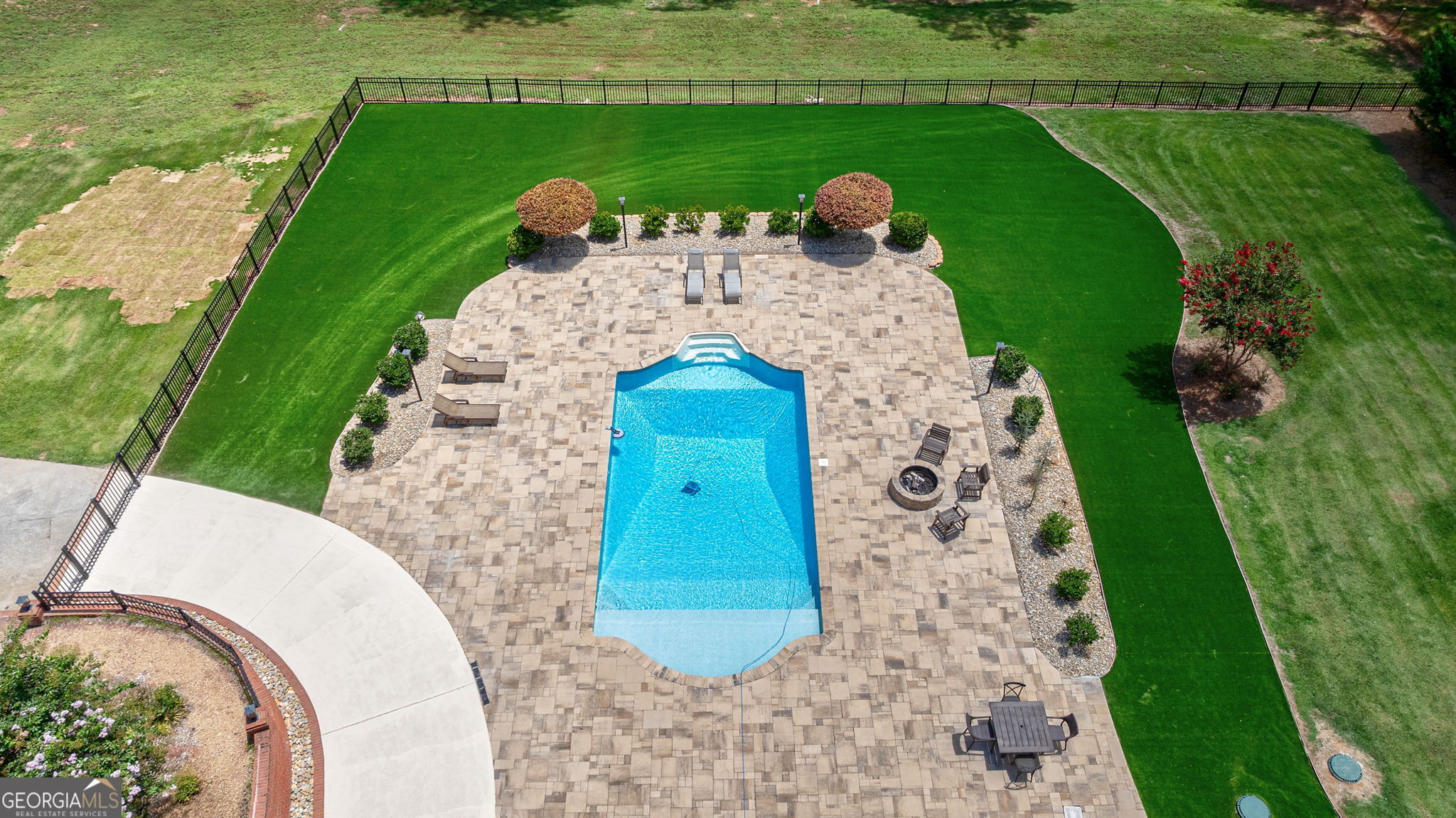 2391 Rabbit Farm Circle Loganville, GA 30052 - Photo 92 of 97 a aerial view of a swimming pool with a yard