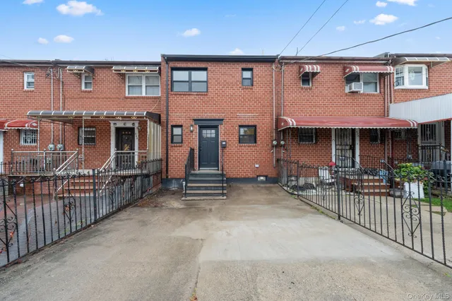 an outdoor view of a house with balcony