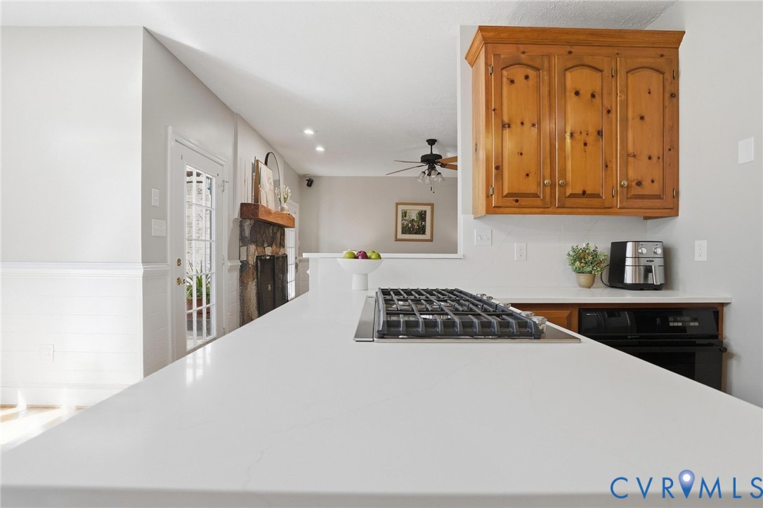 12123 Deer Ridge Court Ashland, VA 23005 - Photo 21 of 63 a kitchen with stainless steel appliances granite countertop a refrigerator and a stove top oven