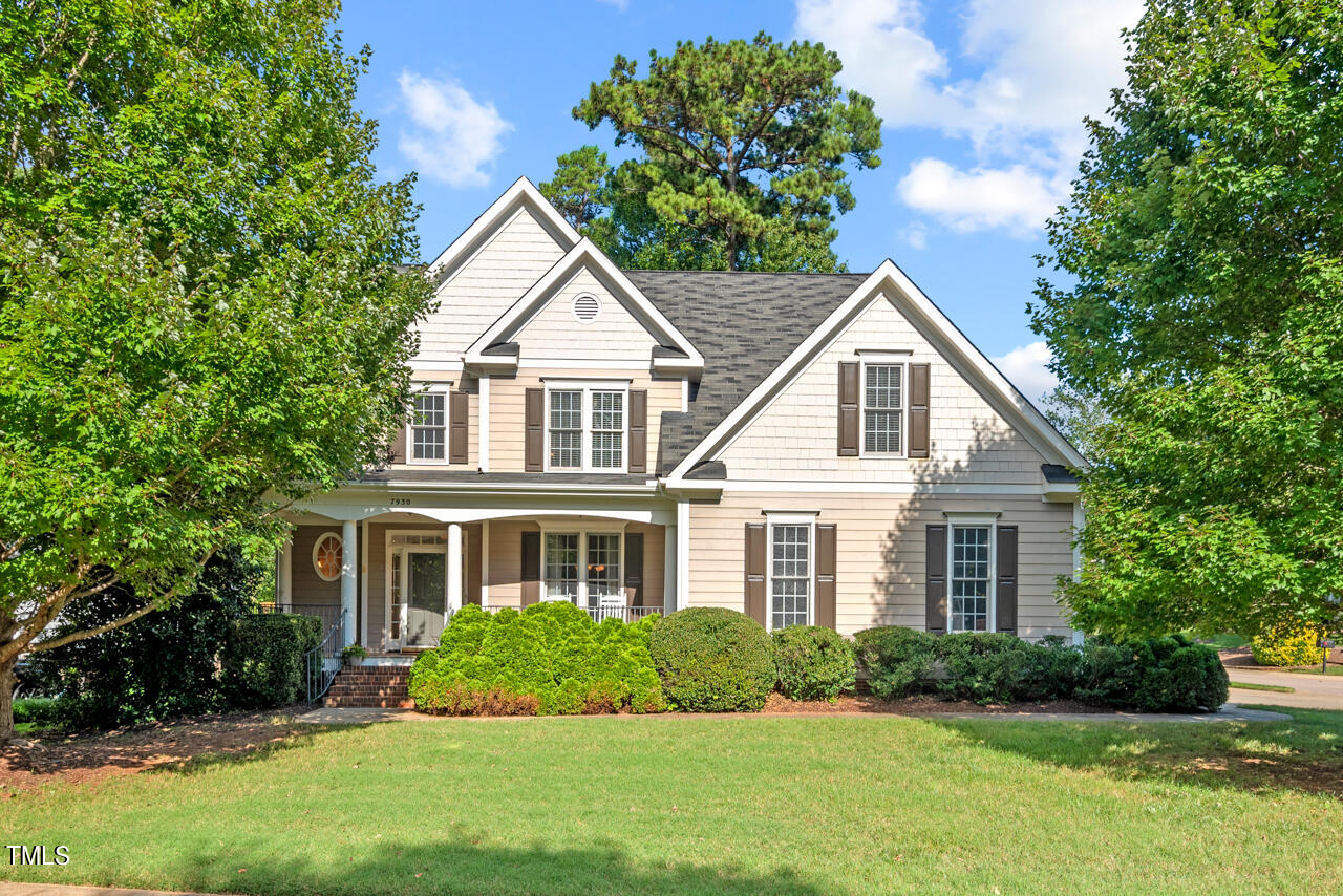 7930 Pine Timber Drive Raleigh, NC 27613 - Photo 1 of 57 a front view of a house with a yard and garage