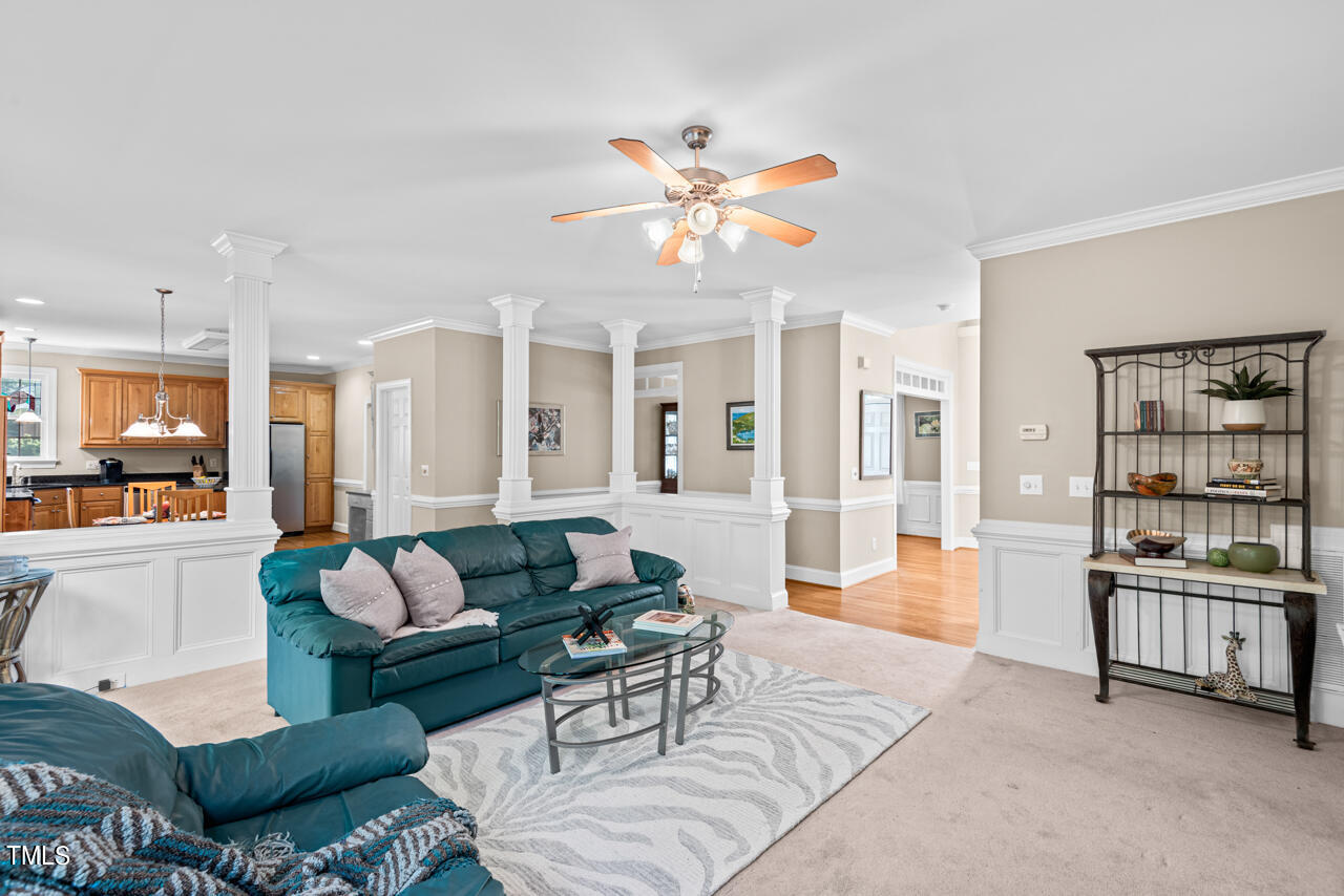 7930 Pine Timber Drive Raleigh, NC 27613 - Photo 15 of 57 a living room with furniture and wooden floor