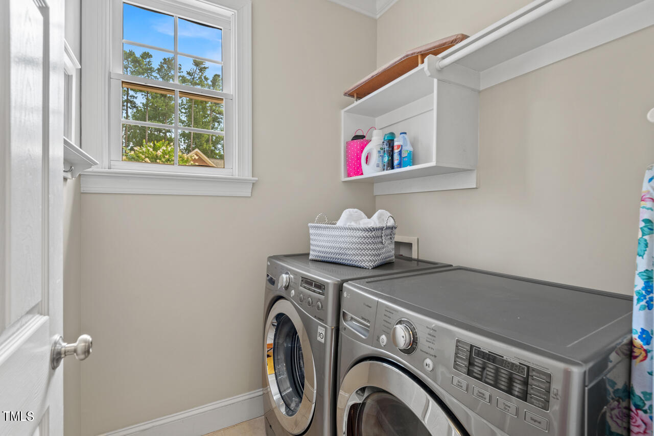 7930 Pine Timber Drive Raleigh, NC 27613 - Photo 25 of 57 a utility room with dryer and washer