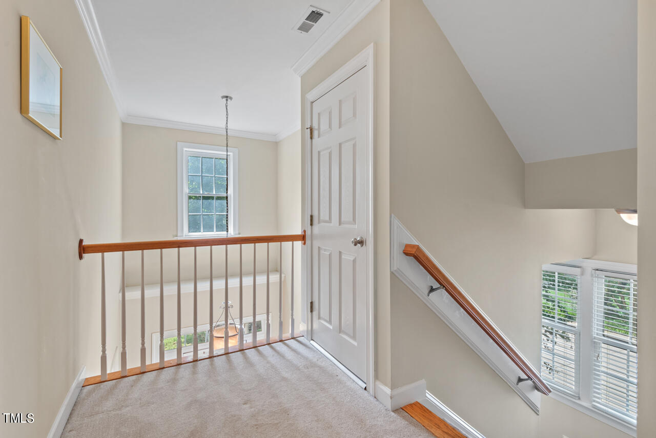 7930 Pine Timber Drive Raleigh, NC 27613 - Photo 30 of 57 a view of a hallway with windows