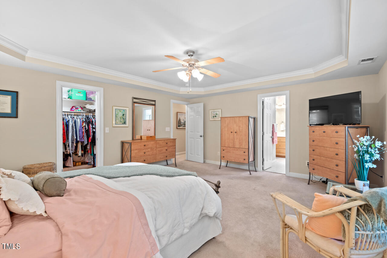 7930 Pine Timber Drive Raleigh, NC 27613 - Photo 34 of 57 a bedroom with a bed and a flat screen tv