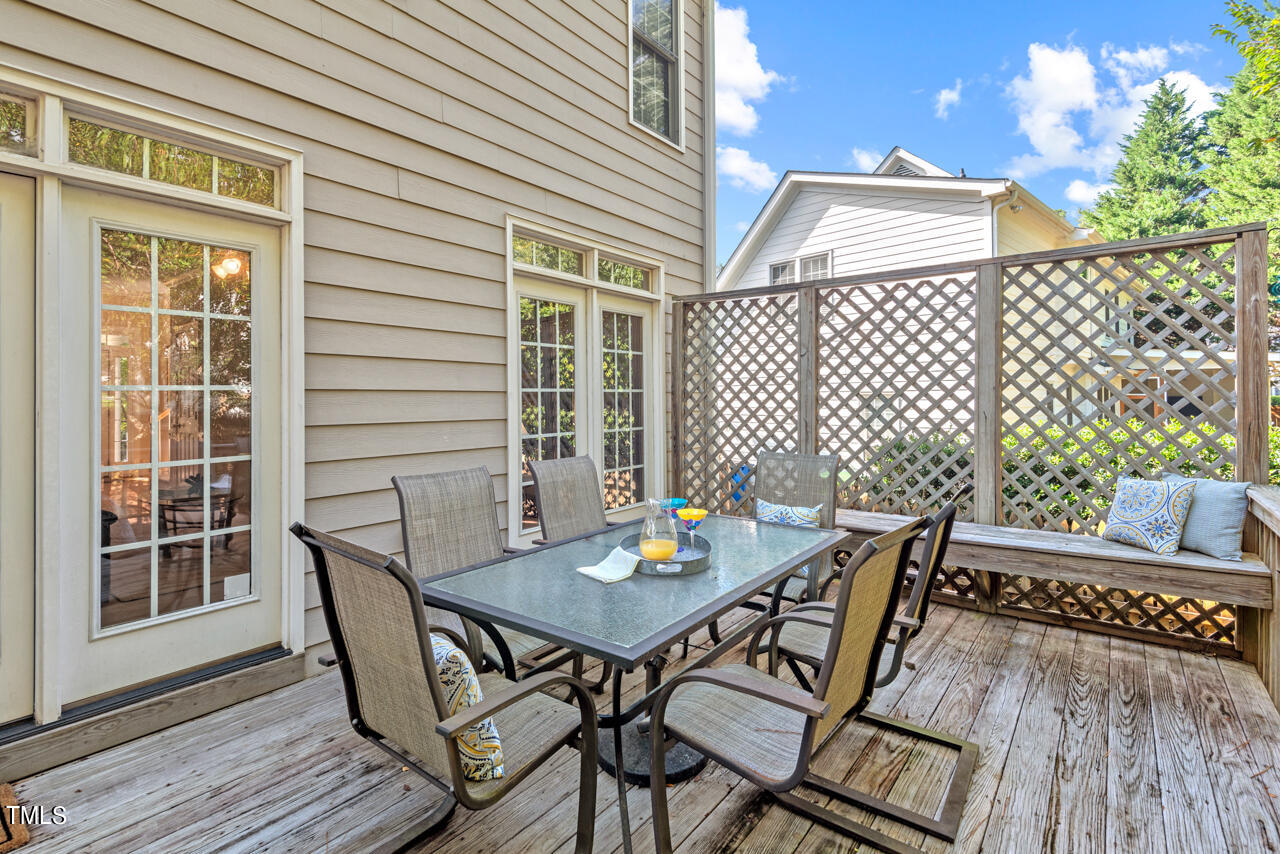 7930 Pine Timber Drive Raleigh, NC 27613 - Photo 46 of 57 a view of a chairs and table on the deck