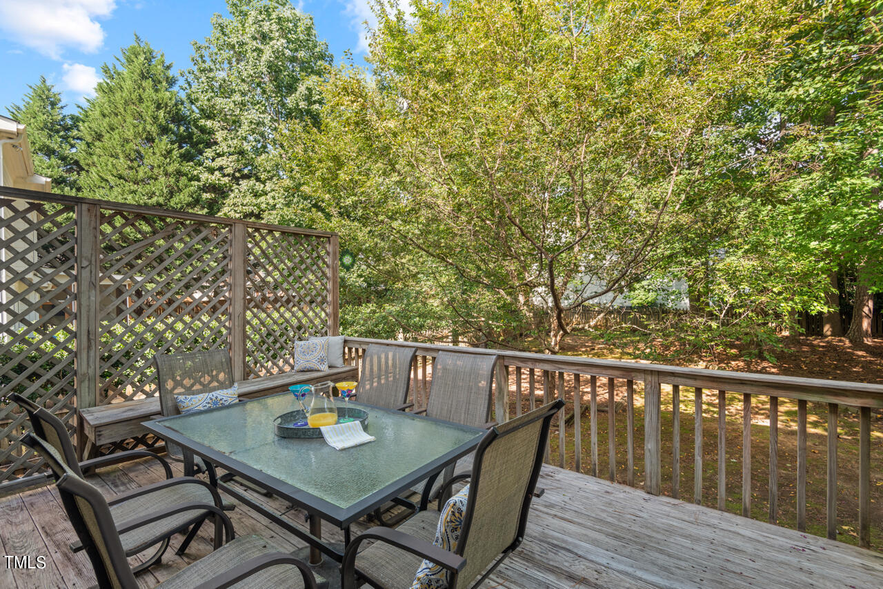 7930 Pine Timber Drive Raleigh, NC 27613 - Photo 47 of 57 a view of balcony with wooden floor and outdoor seating