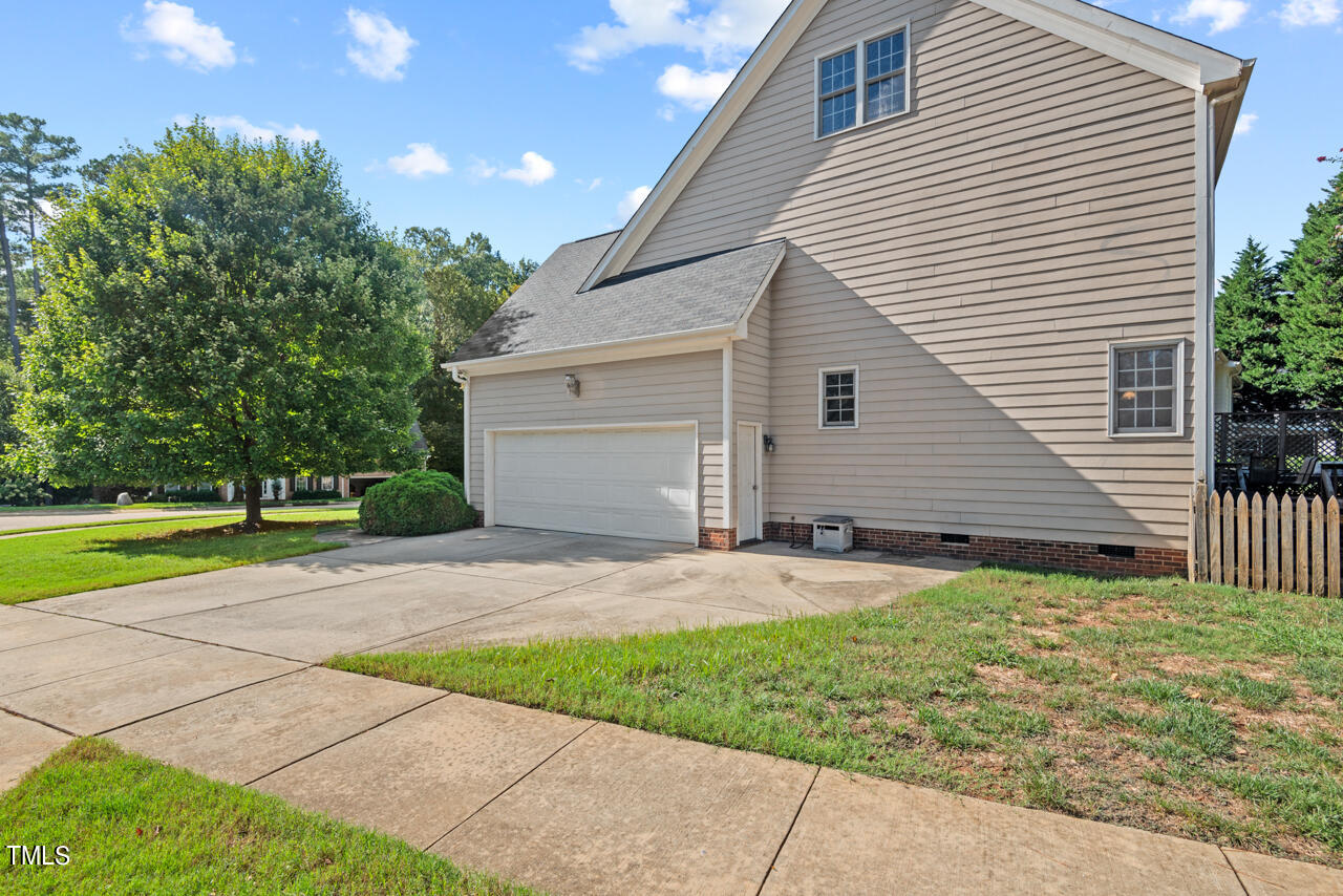 7930 Pine Timber Drive Raleigh, NC 27613 - Photo 53 of 57 a backyard of a house with table and chairs