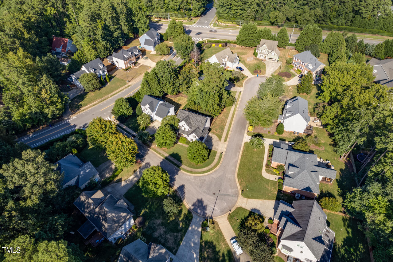 7930 Pine Timber Drive Raleigh, NC 27613 - Photo 56 of 57 an aerial view of a house with a yard and garden