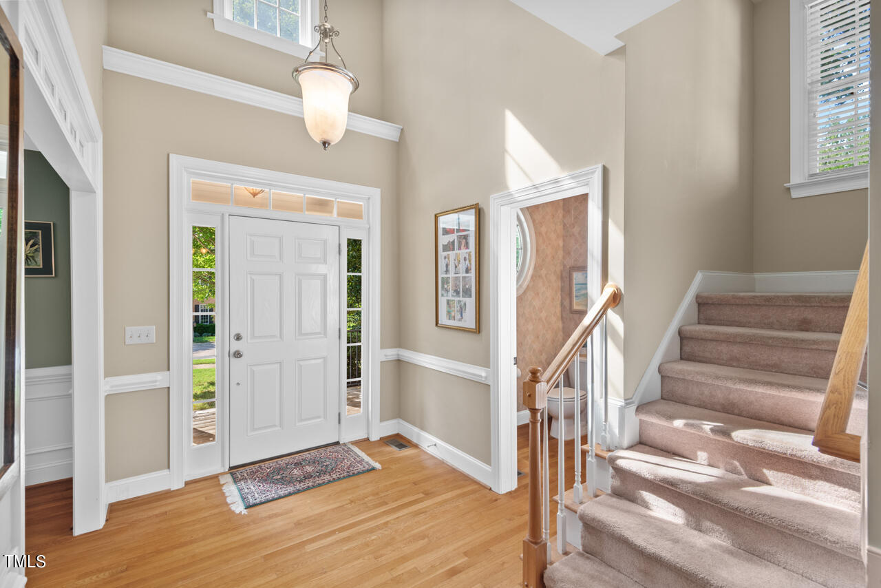 7930 Pine Timber Drive Raleigh, NC 27613 - Photo 6 of 57 a view of entryway and hall with wooden floor