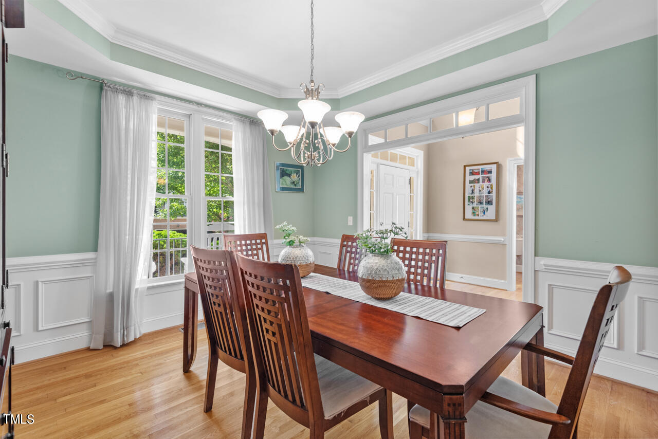 7930 Pine Timber Drive Raleigh, NC 27613 - Photo 10 of 57 a view of a dining room with furniture window and wooden floor