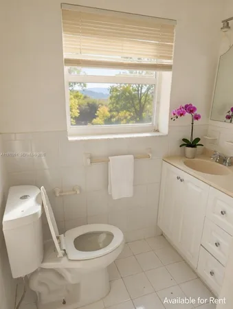 a bathroom with a toilet and a sink