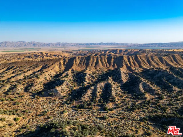 an aerial view of residential building and ocean