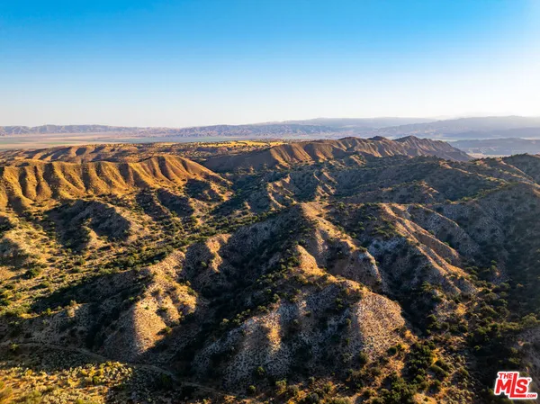 a view of a city with mountains in the background