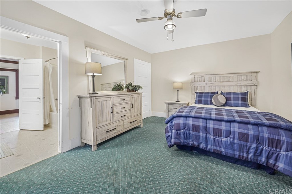 402 Virginia Street El Segundo, CA 90245 - Photo 15 of 22 a bedroom with a bed and chandelier