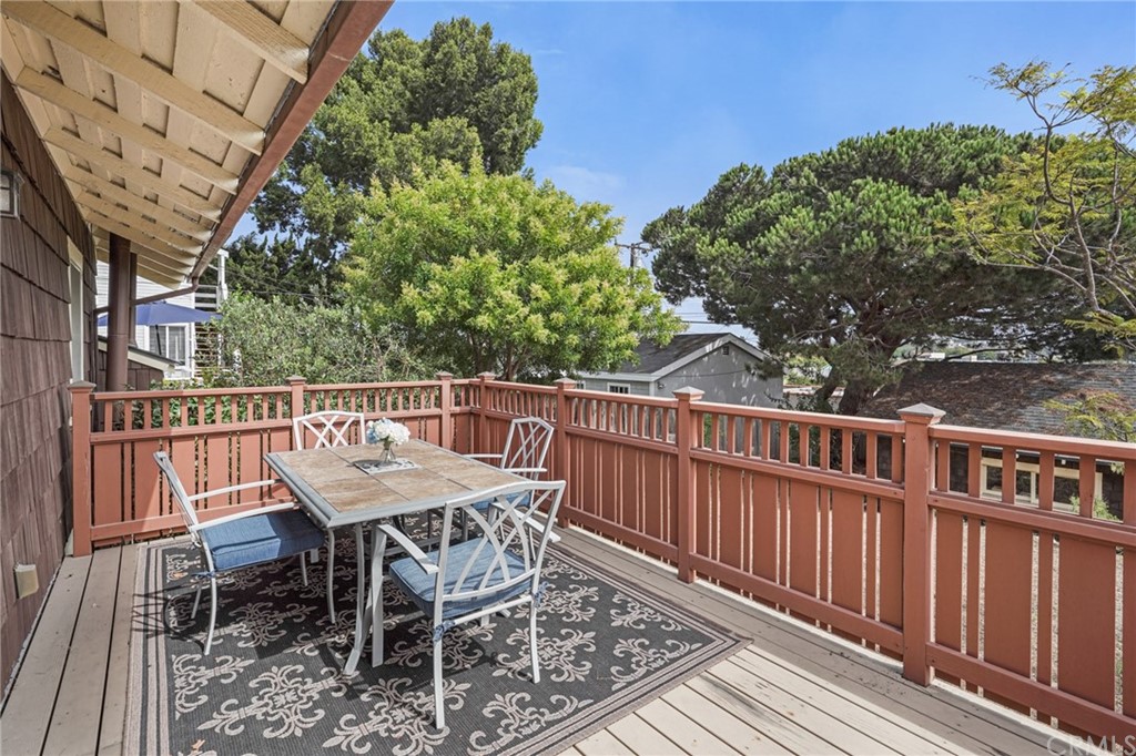 402 Virginia Street El Segundo, CA 90245 - Photo 18 of 22 a balcony with wooden floor and fence