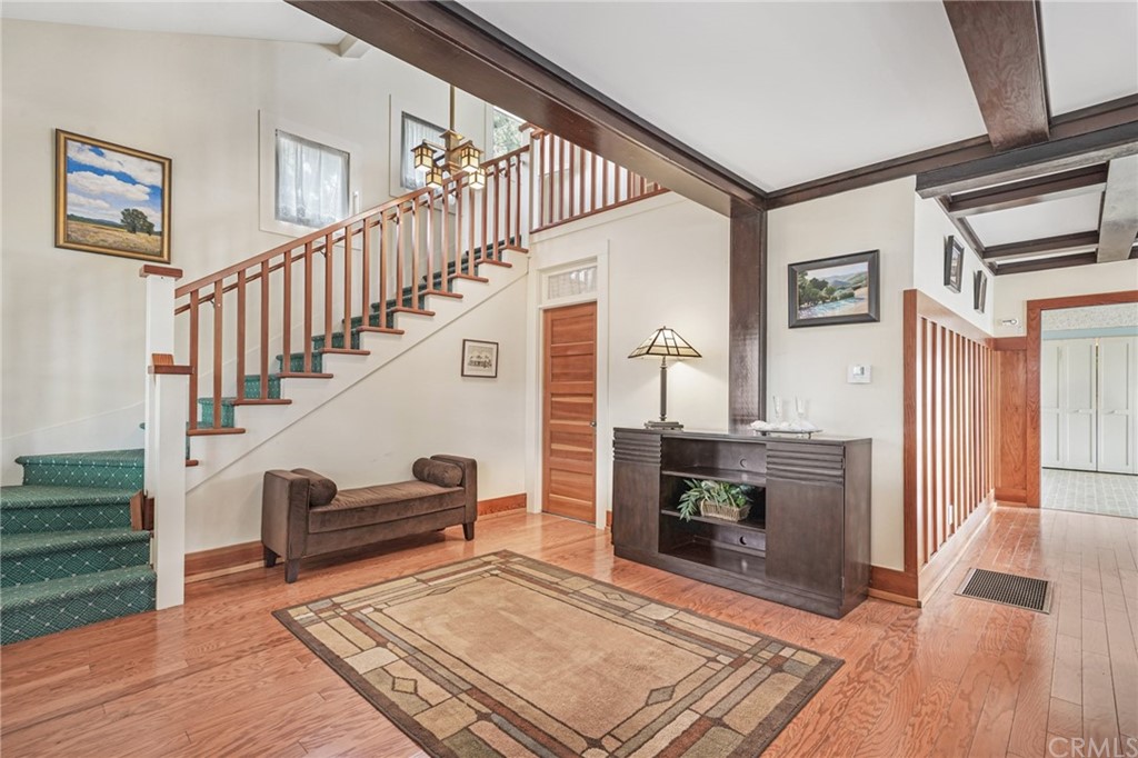 402 Virginia Street El Segundo, CA 90245 - Photo 4 of 22 a living room with wooden floor and a fireplace