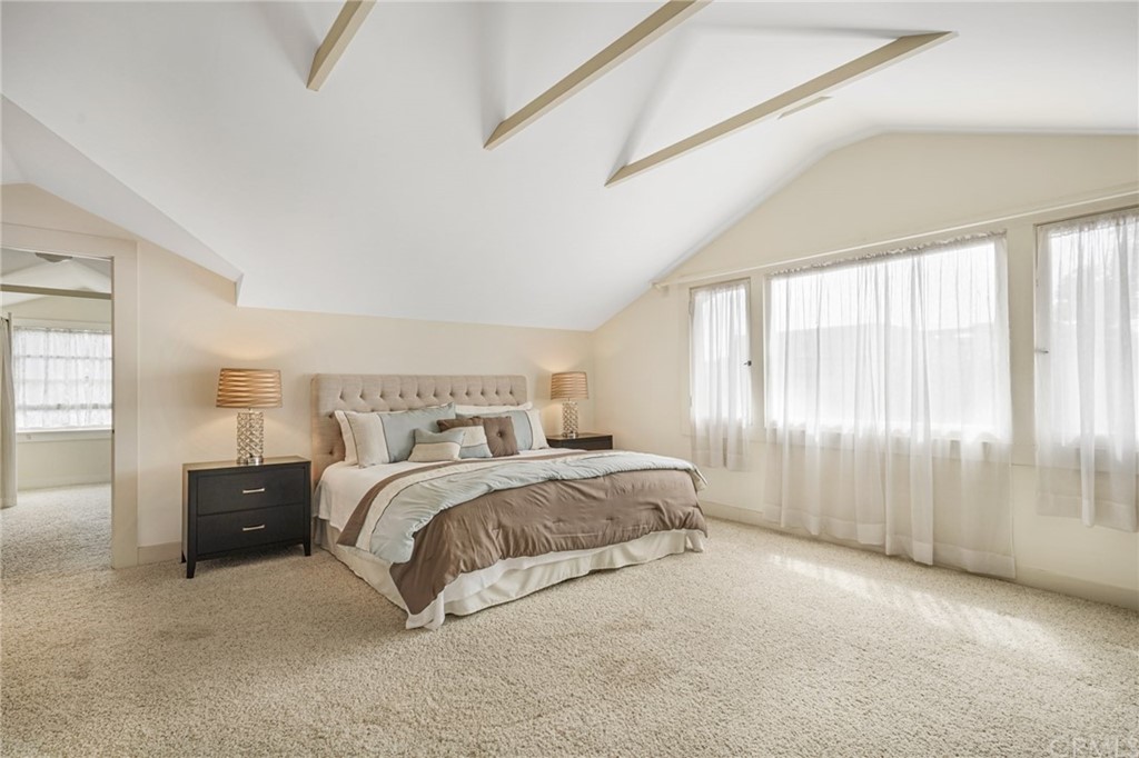 402 Virginia Street El Segundo, CA 90245 - Photo 8 of 22 a spacious bedroom with a bed and a large window