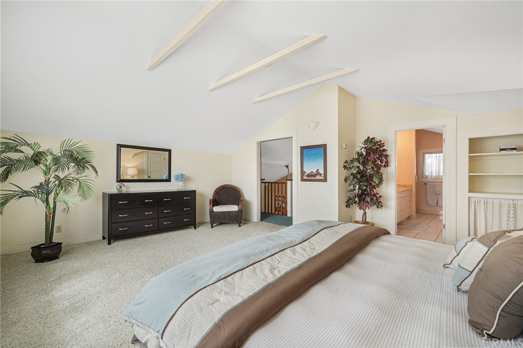 402 Virginia Street El Segundo, CA 90245 - Photo 9 of 22 a bedroom with a large bed and a couch