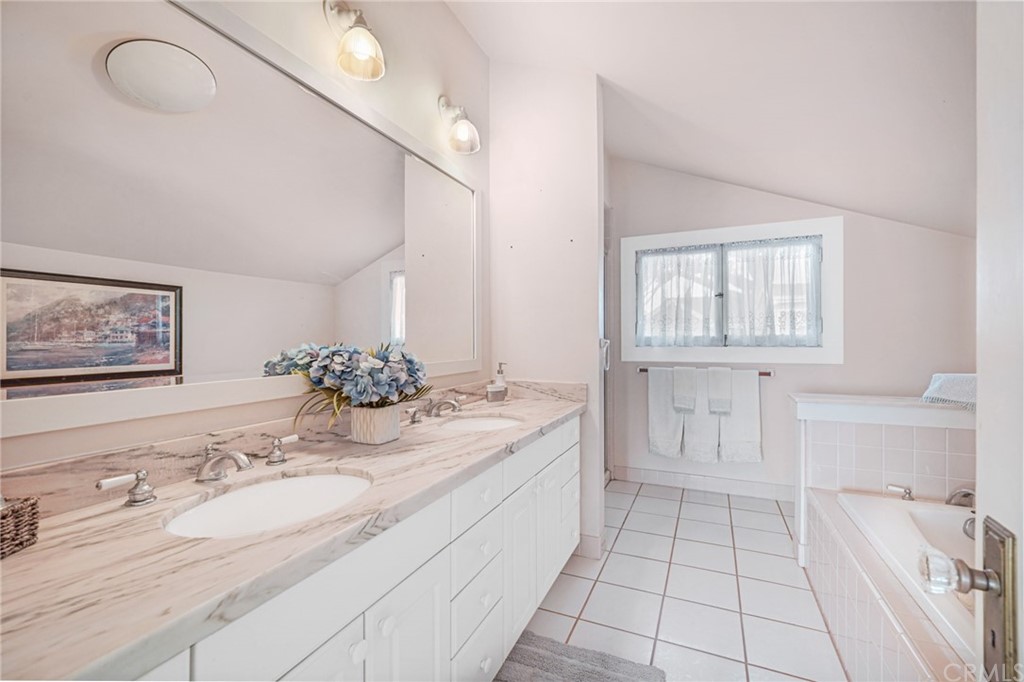 402 Virginia Street El Segundo, CA 90245 - Photo 10 of 22 a spacious bathroom with a granite countertop sink and a mirror
