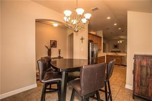 1409 Rosson Road Little Elm, TX 75068 - Photo 24 of 34 Dining area featuring tiled flooring and a chandelier