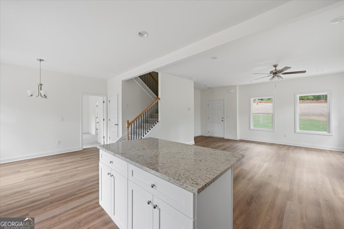 2778 Boxankle Road Forsyth, GA 31029 - Photo 11 of 21 a kitchen with stainless steel appliances granite countertop a sink and wooden floor