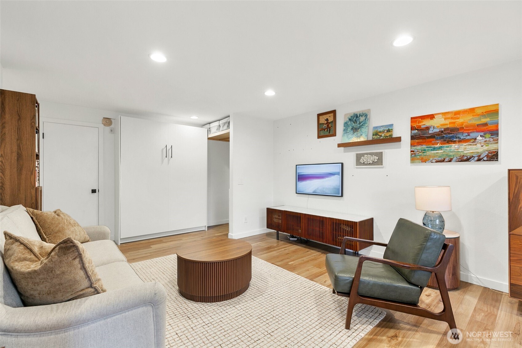 335 Heather Road, Unit 208 Everett, WA 98203 - Photo 1 of 15 a living room with furniture and a flat screen tv