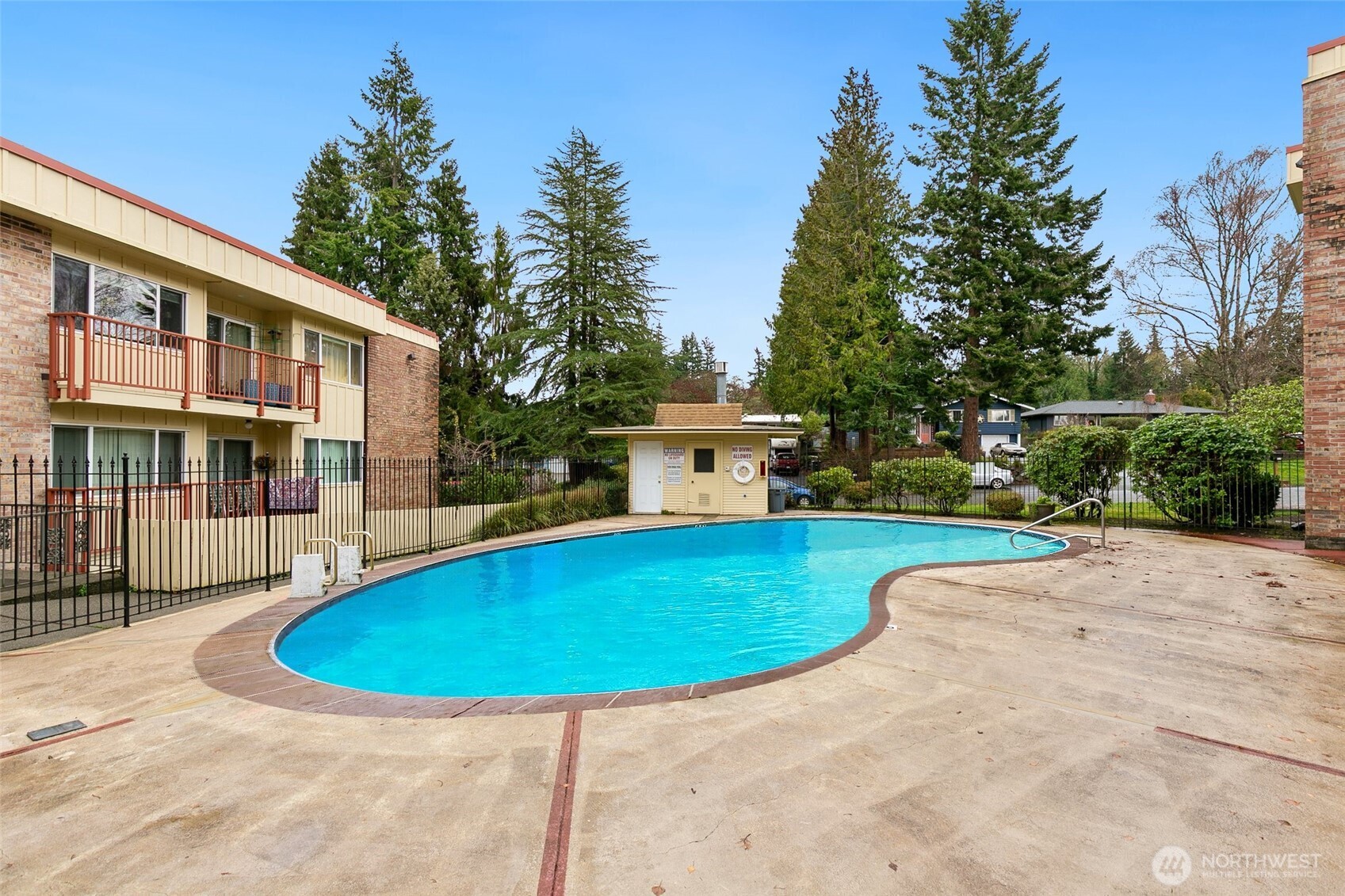 335 Heather Road, Unit 208 Everett, WA 98203 - Photo 15 of 15 a view of a swimming pool with a patio