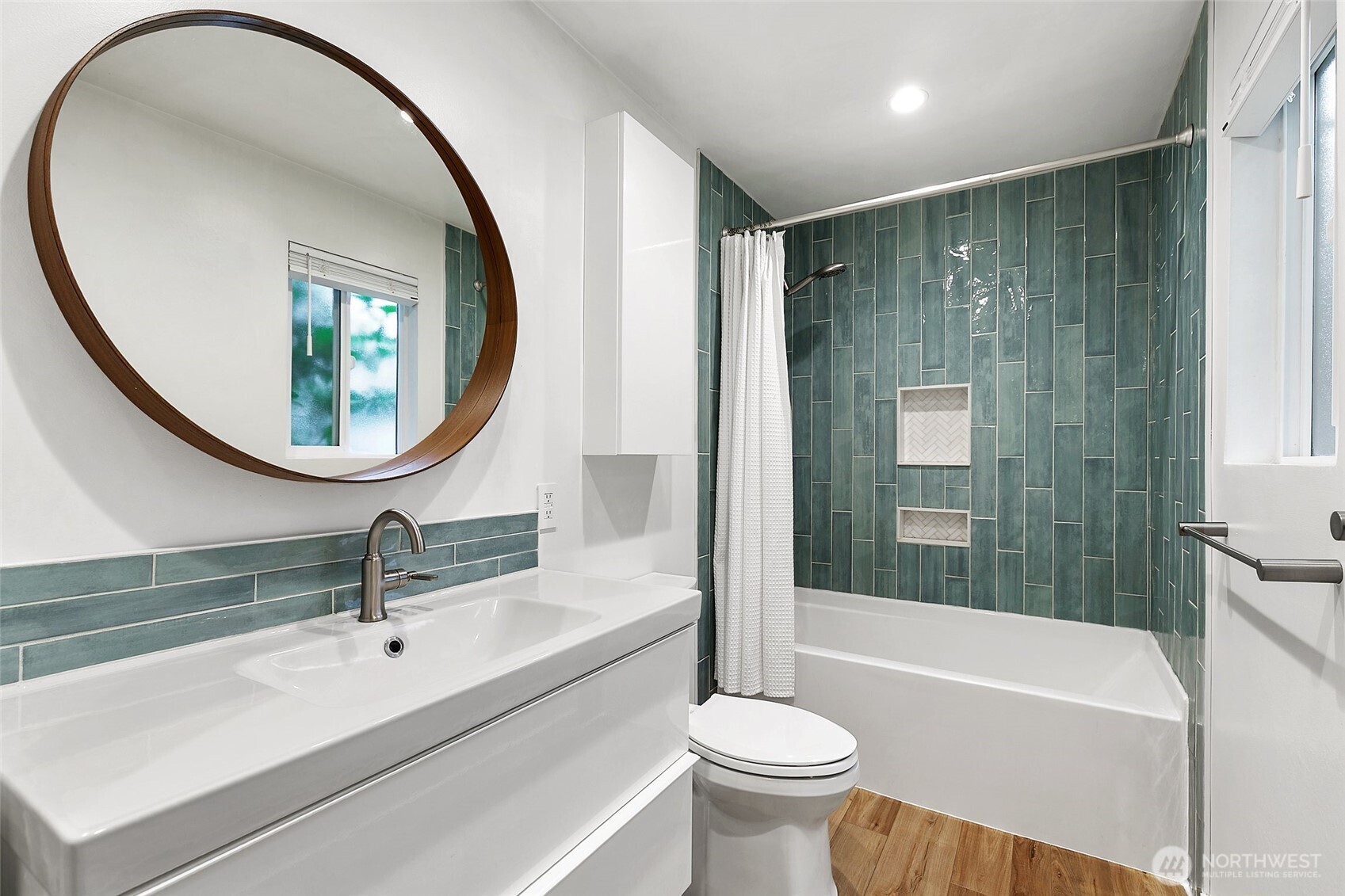 335 Heather Road, Unit 208 Everett, WA 98203 - Photo 10 of 15 a bathroom with a sink and a mirror
